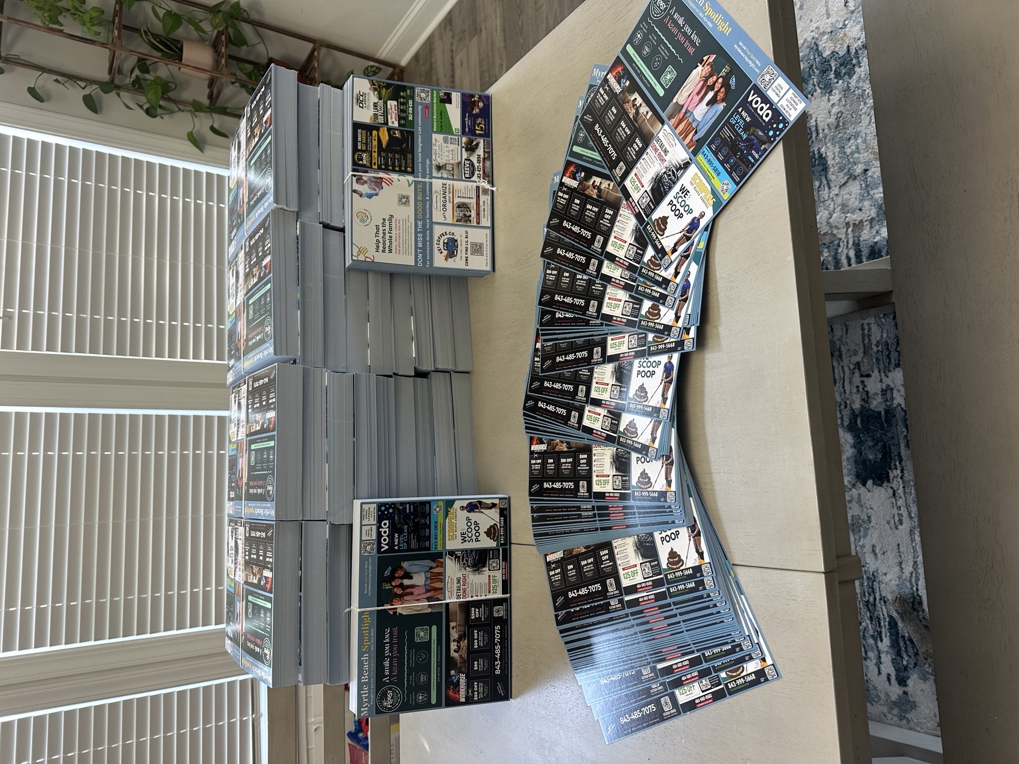 Myrtle Beach Spotlight postcard stacks showing real printed advertisements