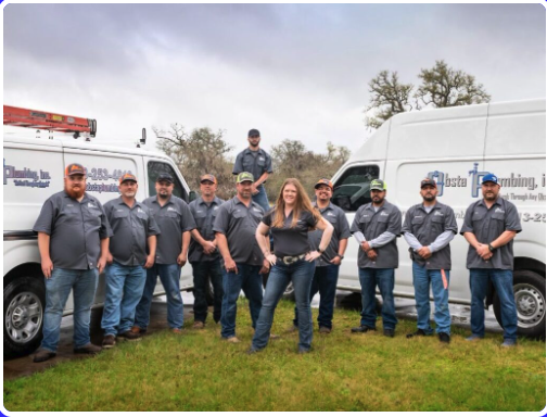 The Obsta Plumbing team in front of their service vans