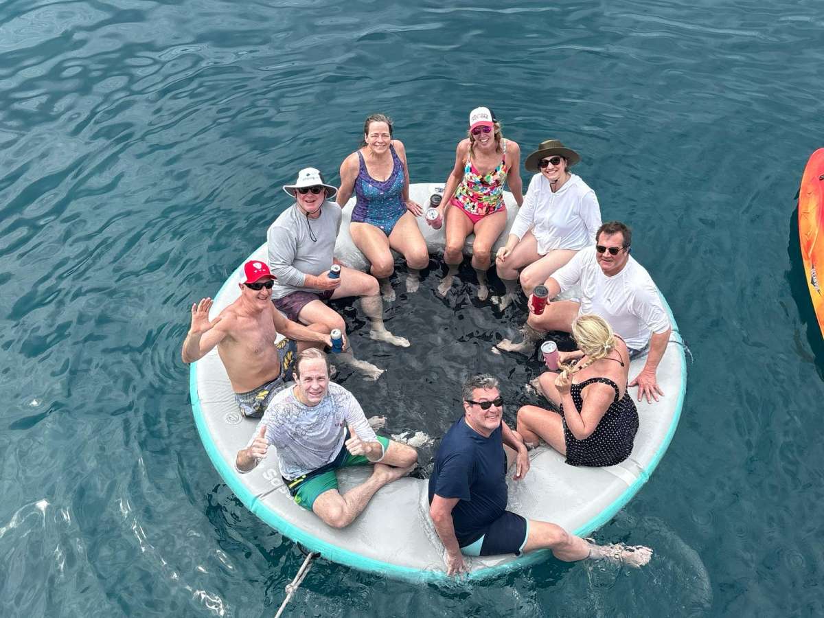 Guests enjoying water toys in the crystal waters of the BVI