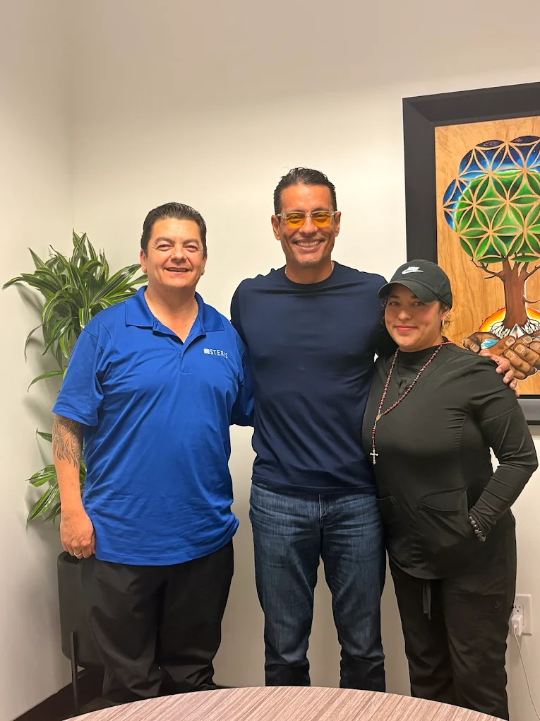 First-time homebuyer family at closing with The Mortgage Phoenix Group.