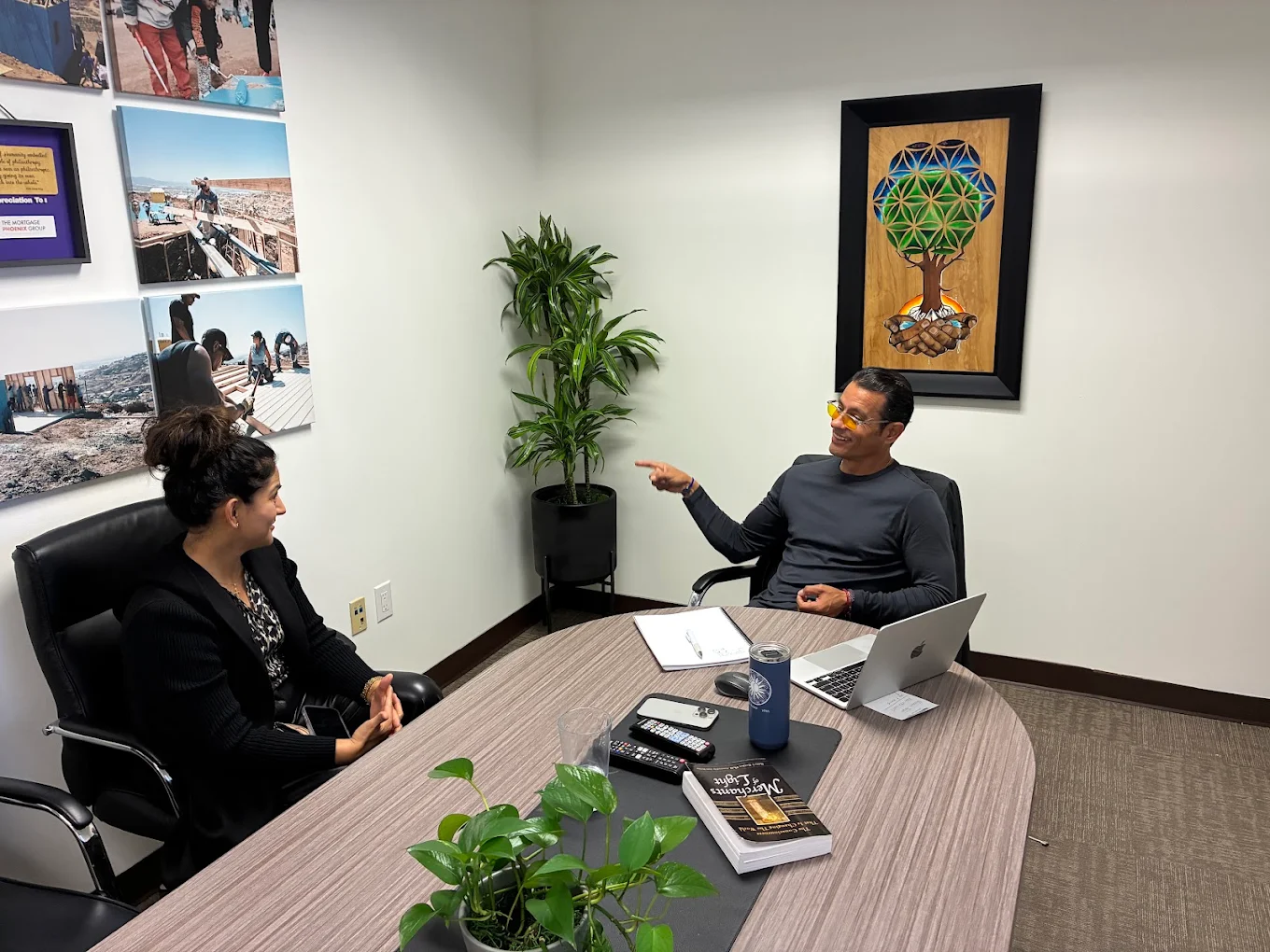 First-time homebuyer family at closing with The Mortgage Phoenix Group.