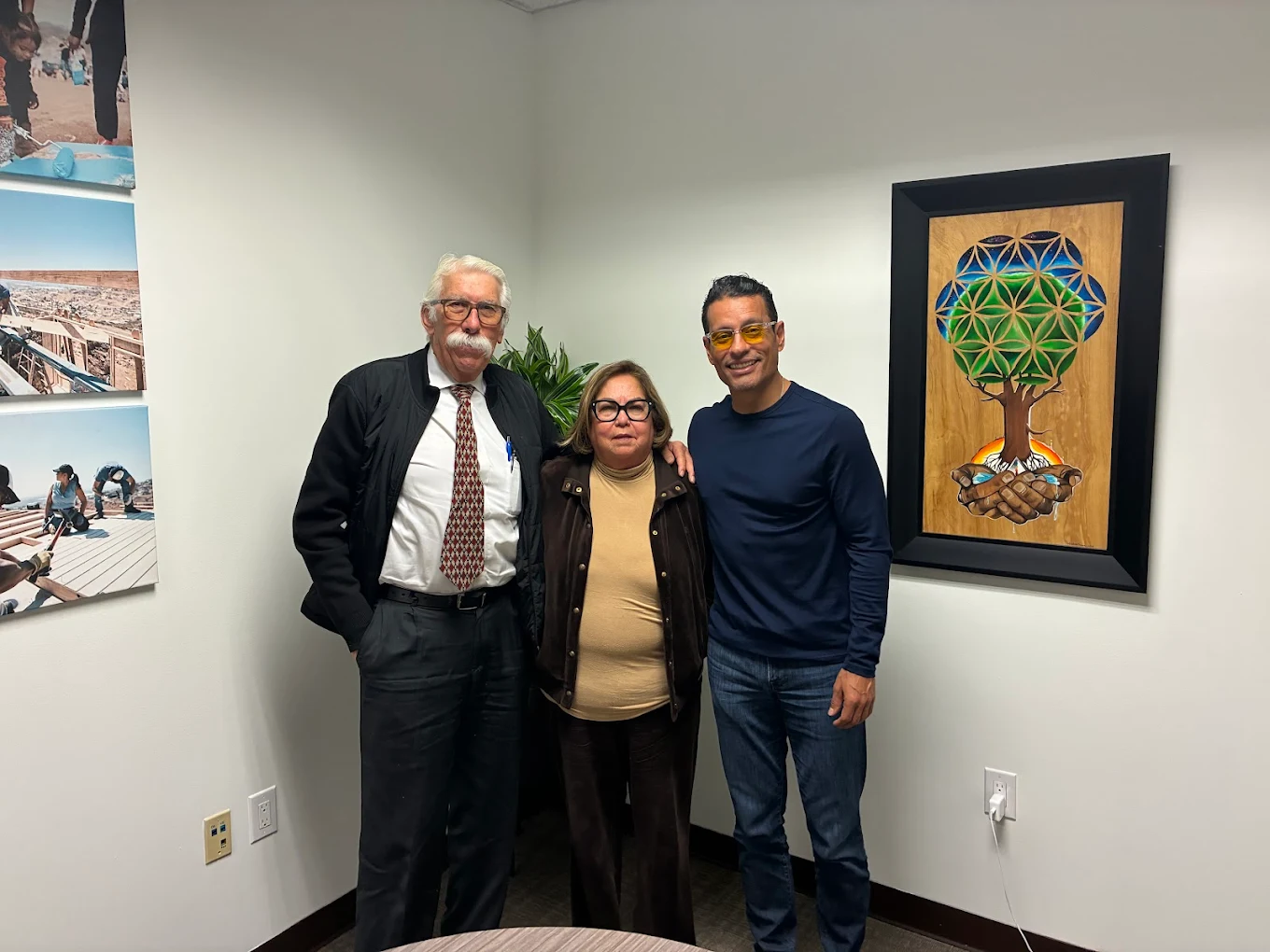 First-time homebuyer family at closing with The Mortgage Phoenix Group.