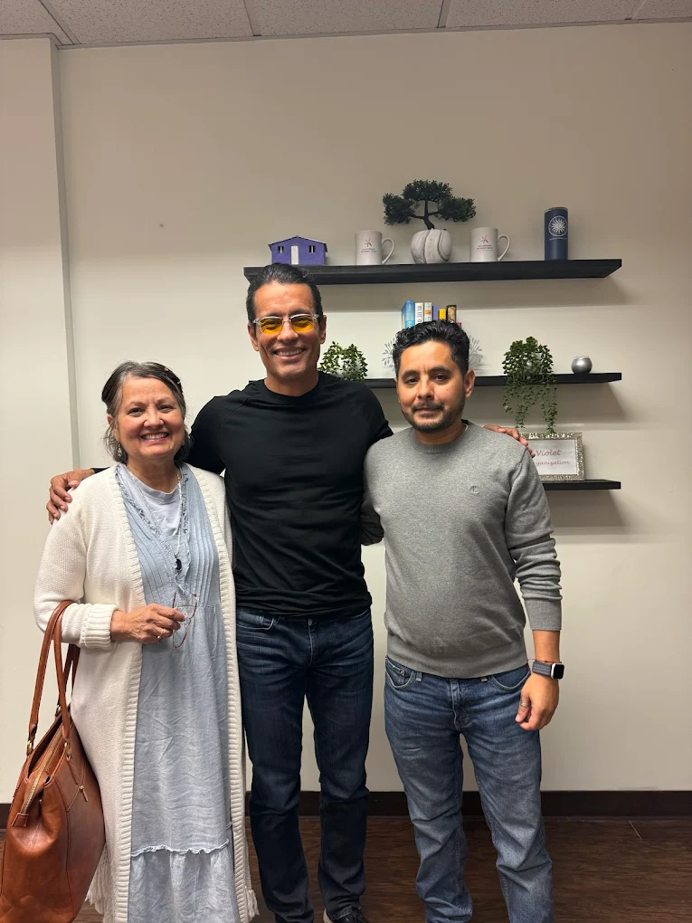 First-time homebuyer family at closing with The Mortgage Phoenix Group.