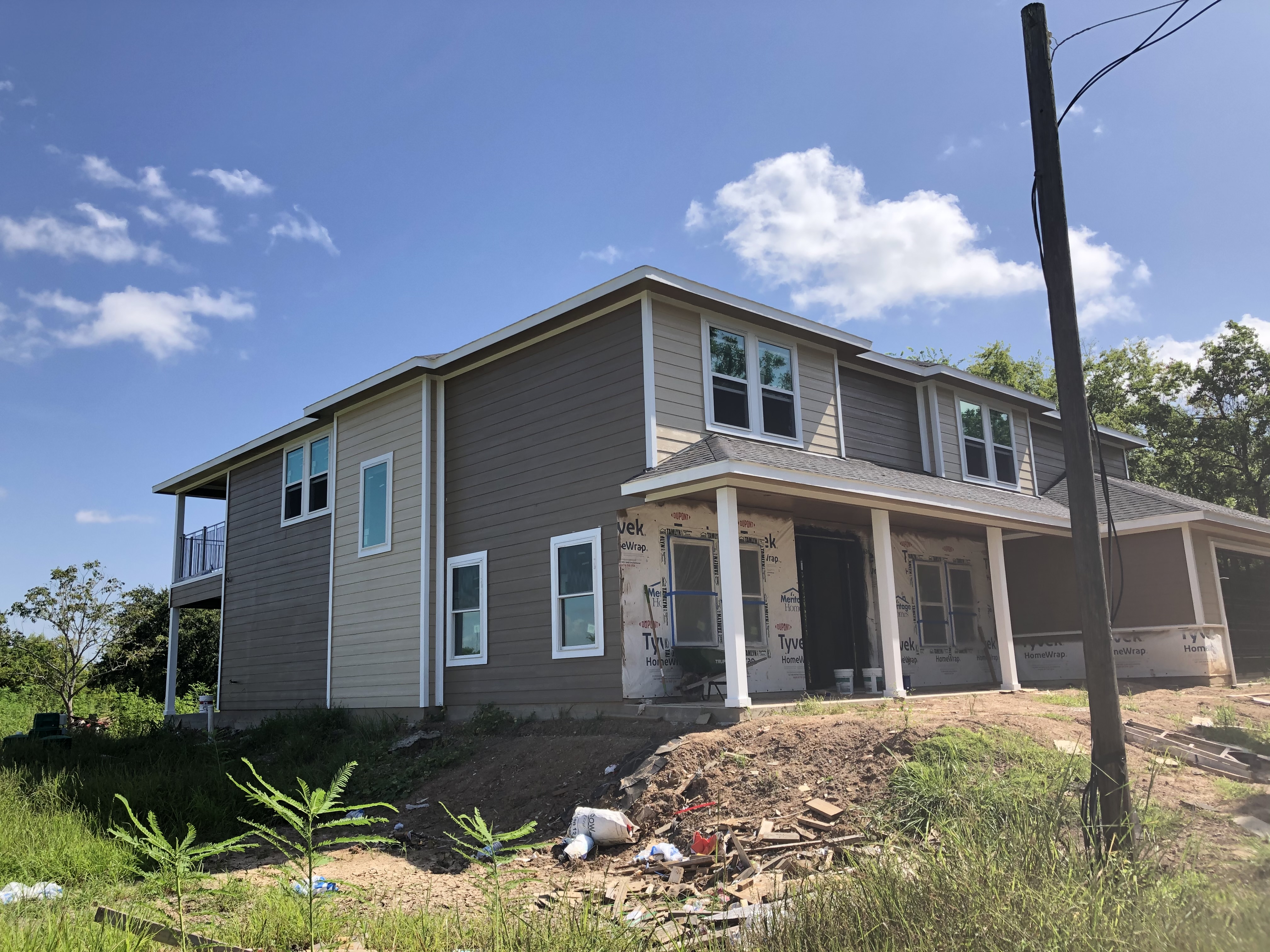 Exterior painting of a two-story home in Sugar Land, TX — photo 1 of 5
