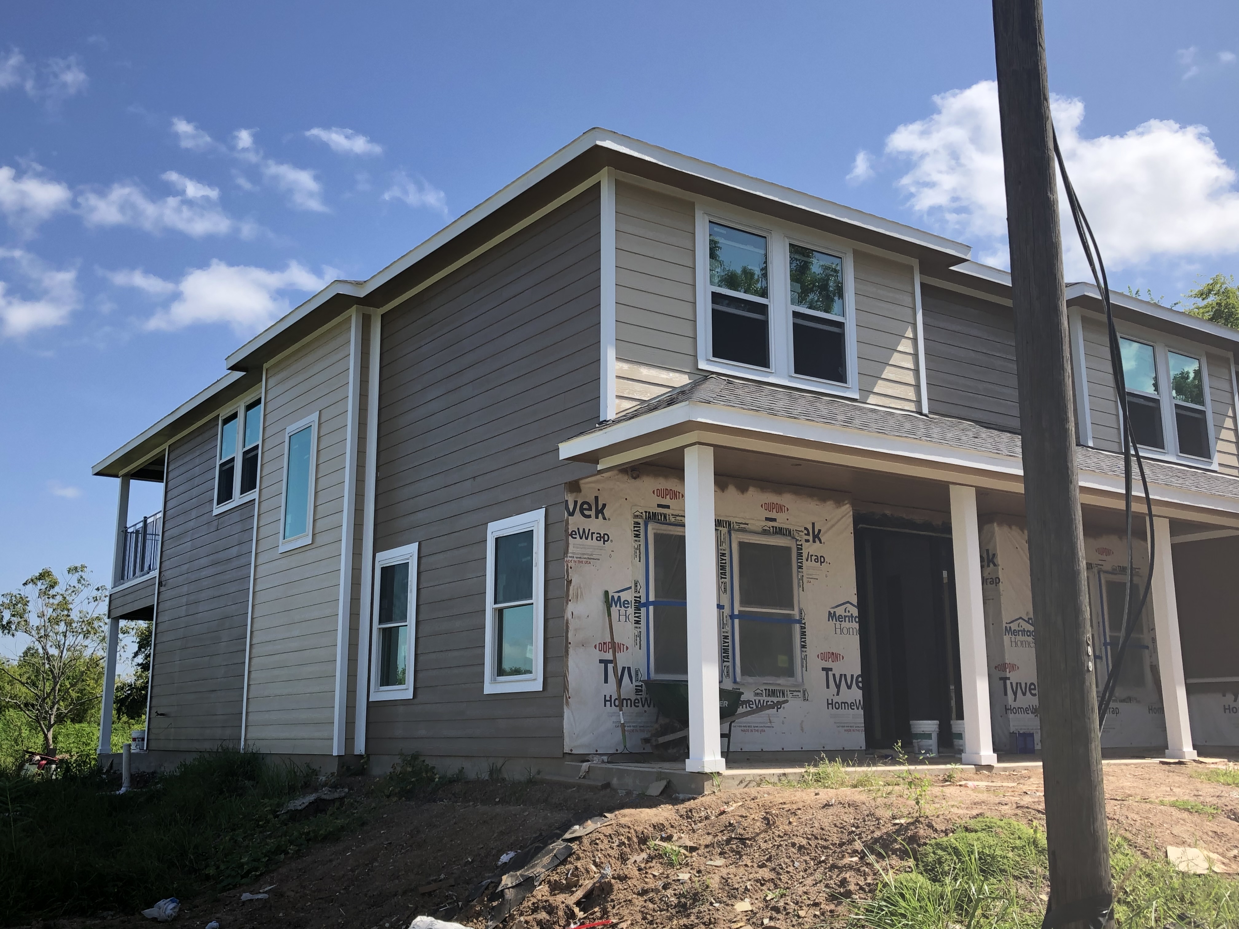 Exterior painting of a two-story home in Sugar Land, TX — photo 2 of 5