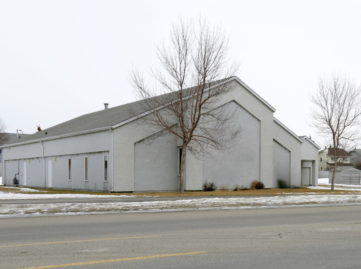 Long side view of the property building along the street