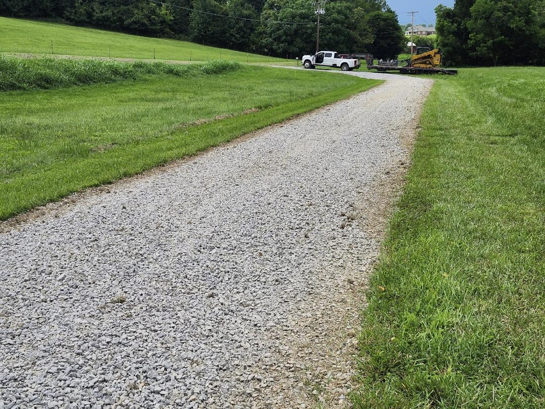 Gravel driveway after regrading and compaction with proper center crown