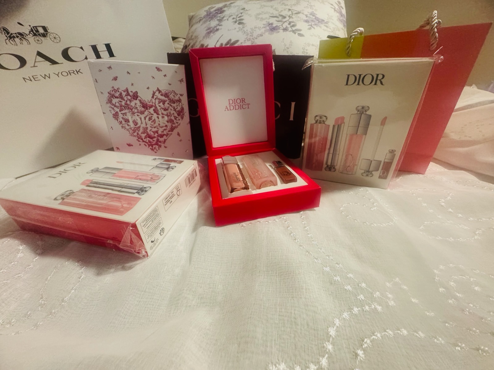 Dior Addict luxury lip glow and beauty gift set collection featuring presentation boxes and Dior shopping bag