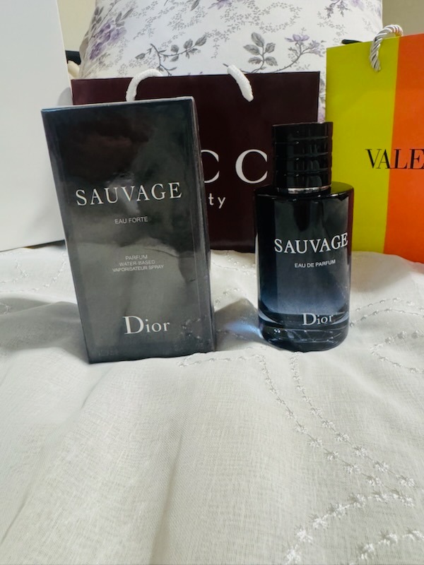 Dior Sauvage Eau Forte Parfum water-based spray bottle with original presentation box and Gucci Beauty bag