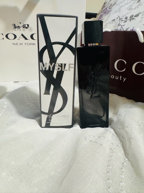 YSL Yves Saint Laurent MYSLF Eau De Parfum black spray bottle with box and luxury shopping bag background