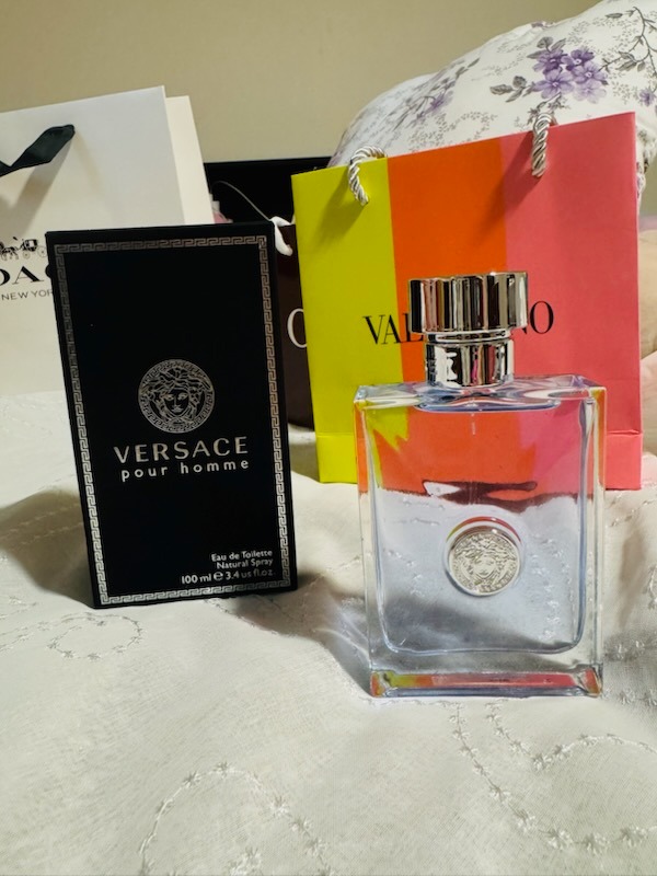 Versace Pour Homme Eau De Toilette 100ml clear bottle with silver Medusa emblem and original black box