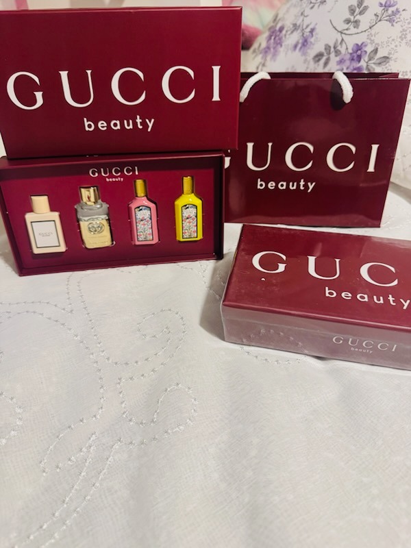Gucci Beauty 4-piece miniature perfume collector gift set in rich burgundy presentation box with Gucci shopping bag