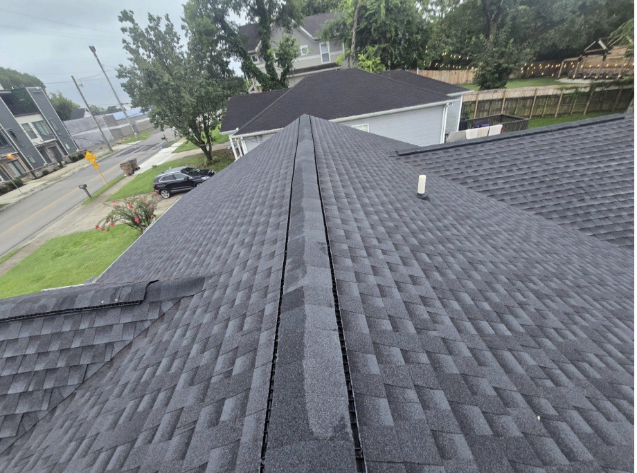 Roof valley detail showing proper shingle installation and water drainage channel