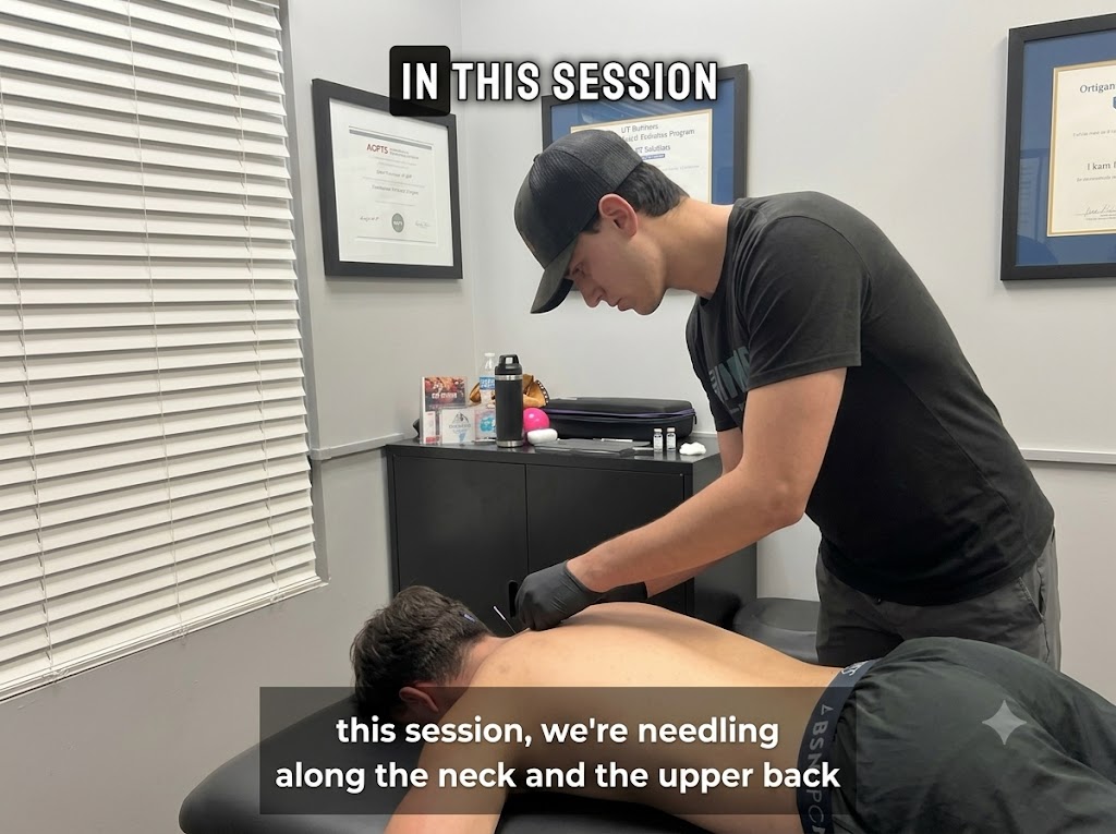 Dr. Caleb Kutsche performing dry needling treatment on a patient's upper back at Incline Performance Therapy in Woodstock GA