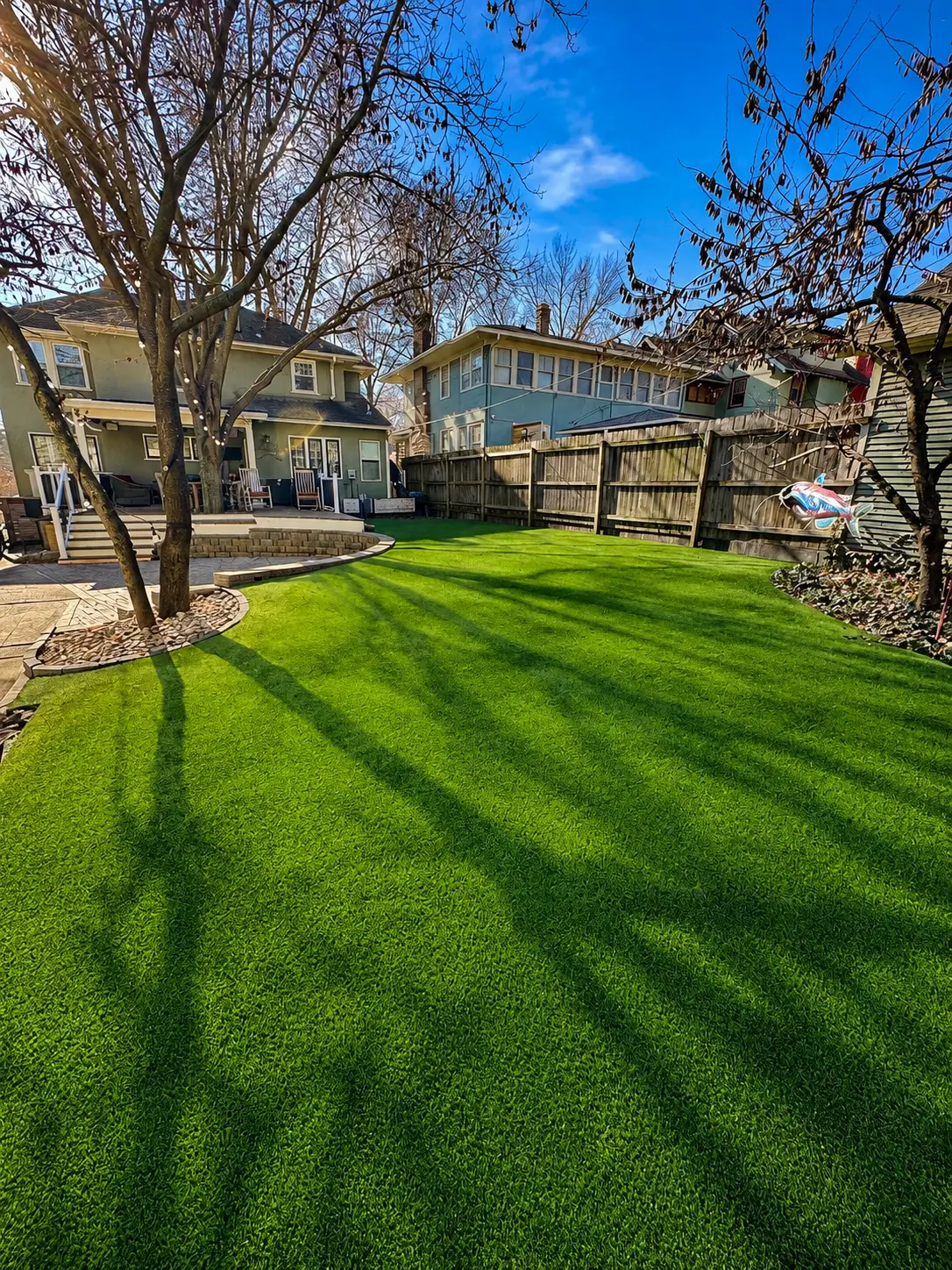 Residential artificial turf installation creating a lush low-maintenance backyard lawn in Kansas City