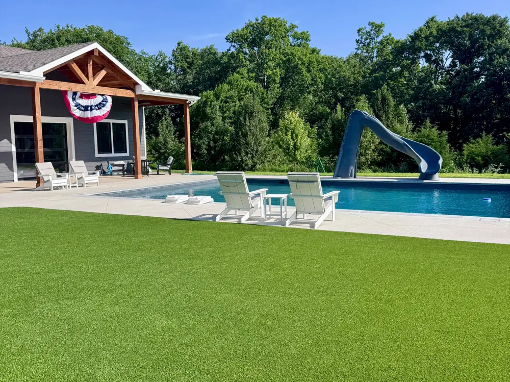 Targeted artificial turf installed in narrow shaded poolside problem area