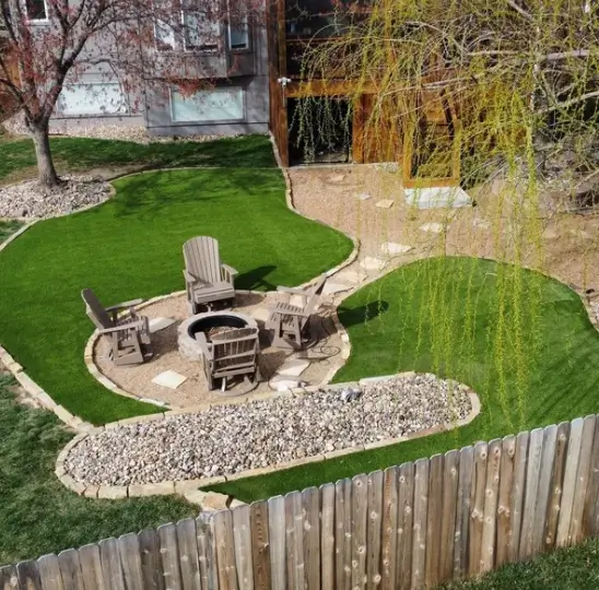 Residential turf integrated with outdoor patio fire pit and living space
