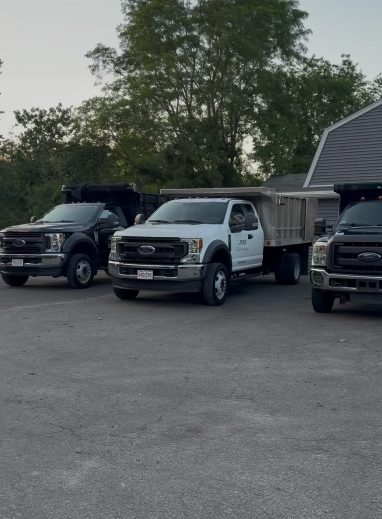 Clean Ford work trucks lined up after fleet detailing service by Bubbles Mobile Detailing on the South Shore MA