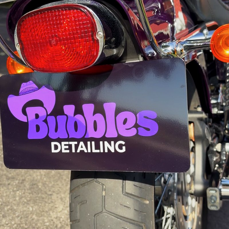 Bubbles Mobile Detailing branded motorcycle plate on a detailed bike