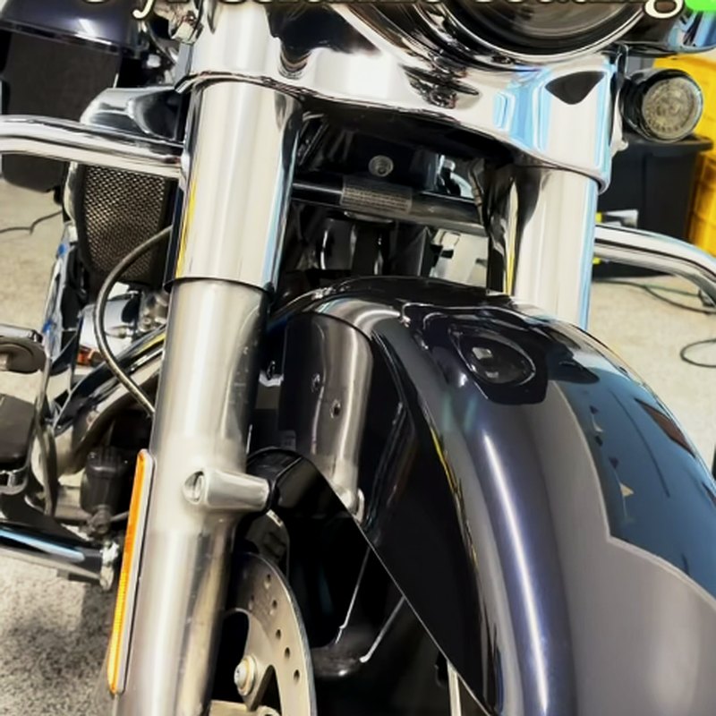 Motorcycle chrome fork and fender detail work showing mirror finish in West Bridgewater MA