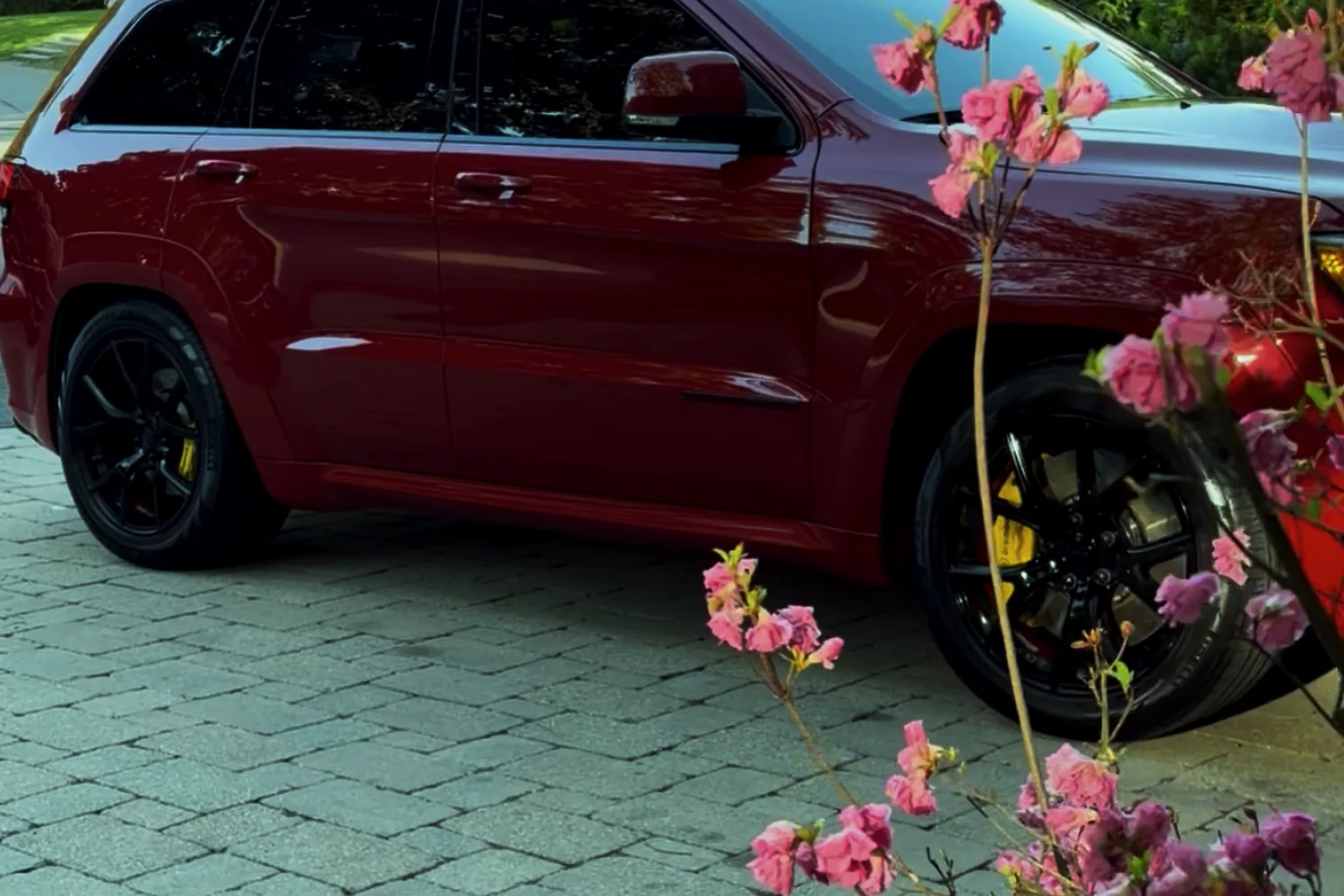 Red SUV after ceramic coating showing deep gloss finish in West Bridgewater MA