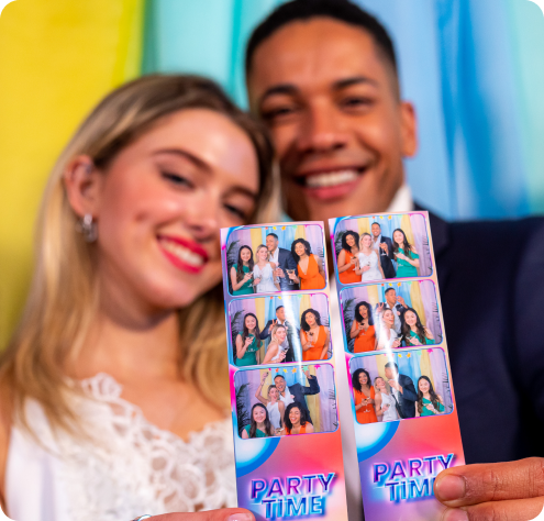 Guests holding photo booth prints from a Noiz Invasion wedding photo booth rental in the Bay Area