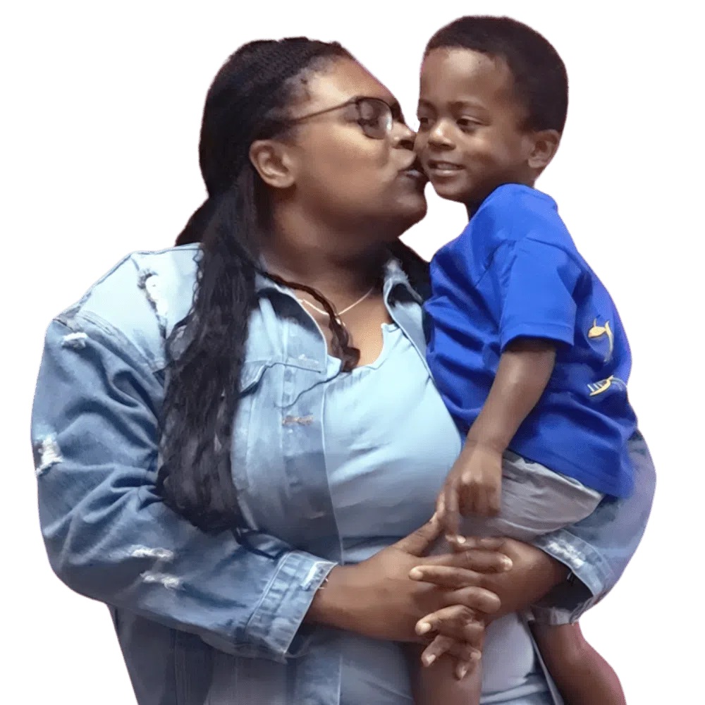 Mother teacher kissing smiling child warm sweet moment