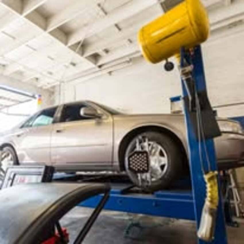 Vehicle on alignment rack at Center Cities Automotive repair facility