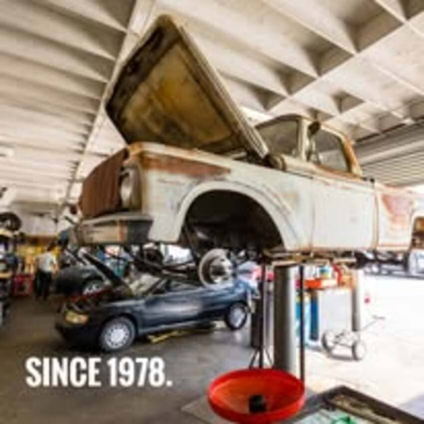 Classic truck on service lift at Center Cities Automotive shop in Whittier, CA