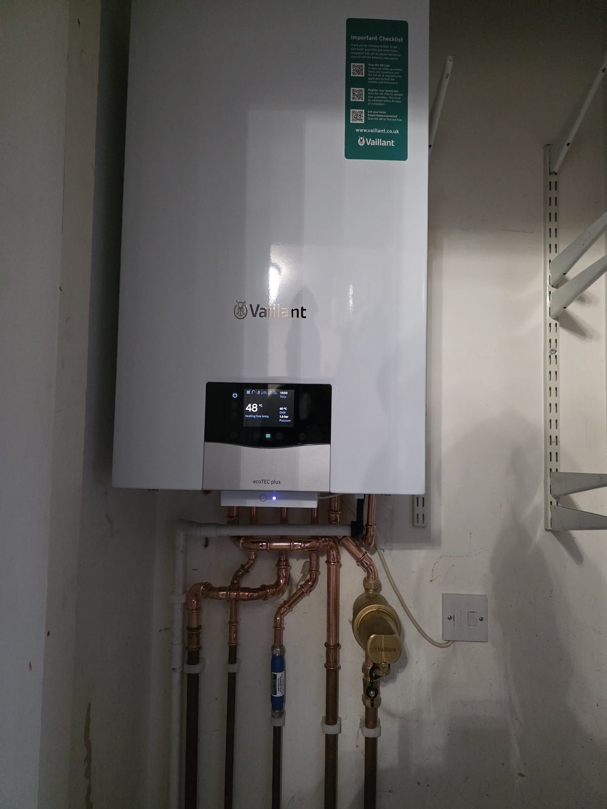 Close-up view of a Vaillant ecoTEC plus boiler display and pipework.