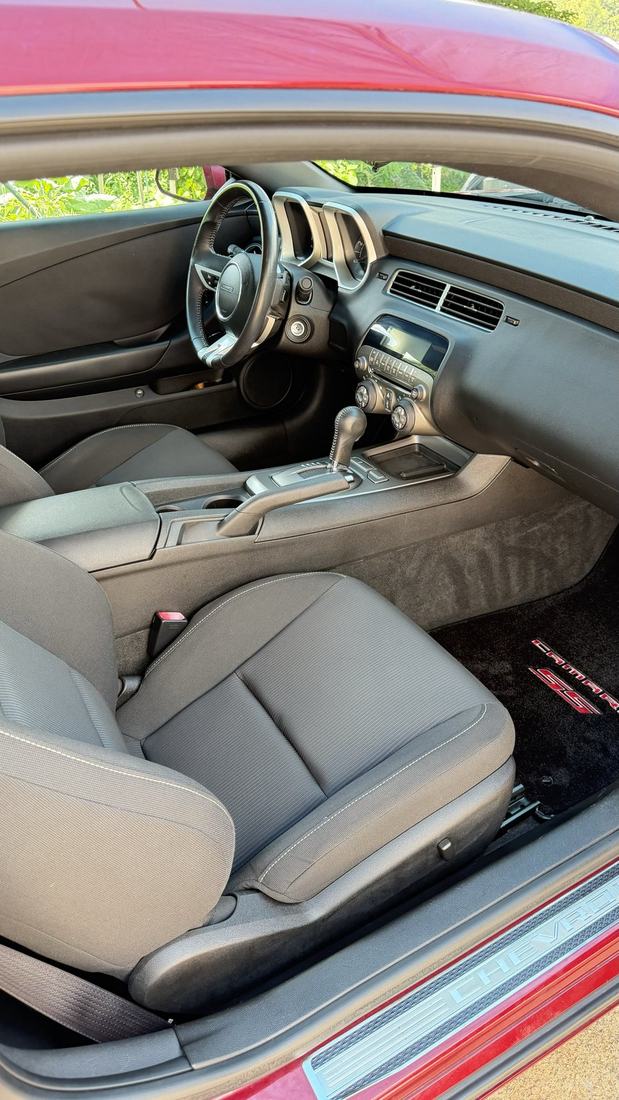 Red Chevrolet Camaro interior after an interior detail