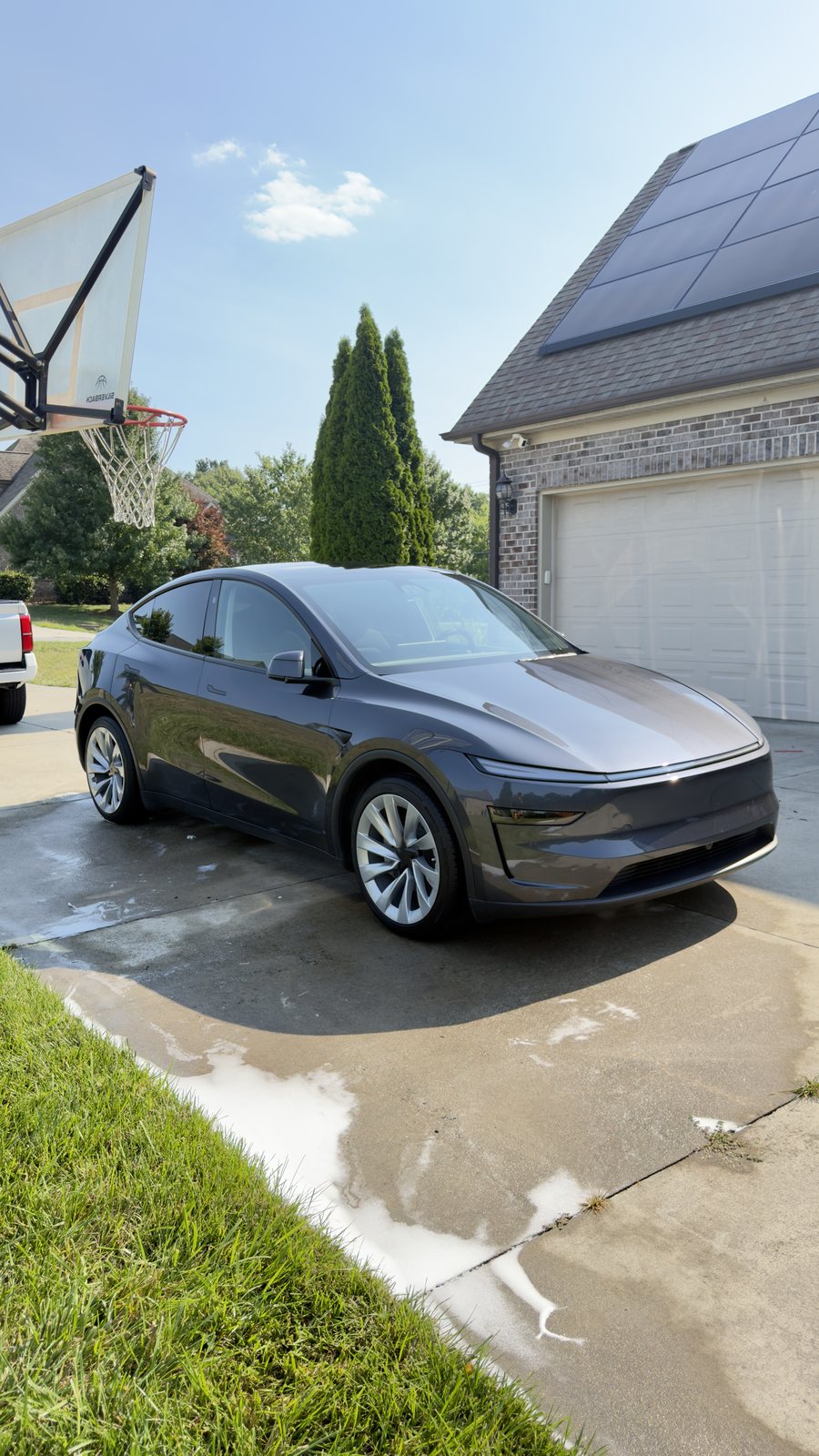 Tesla Model Y mobile auto detailing process in a client driveway in the Triad