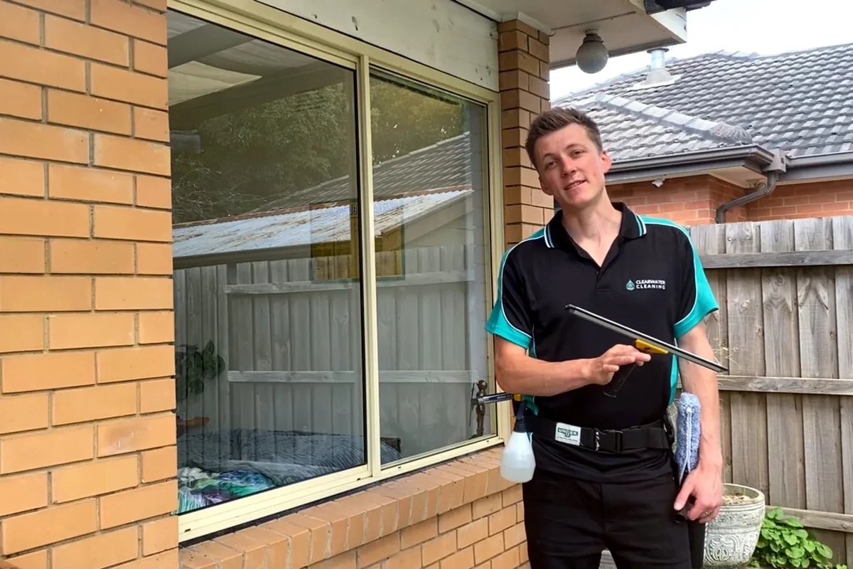 Clearwater Cleaning technician in uniform outside a Melbourne home