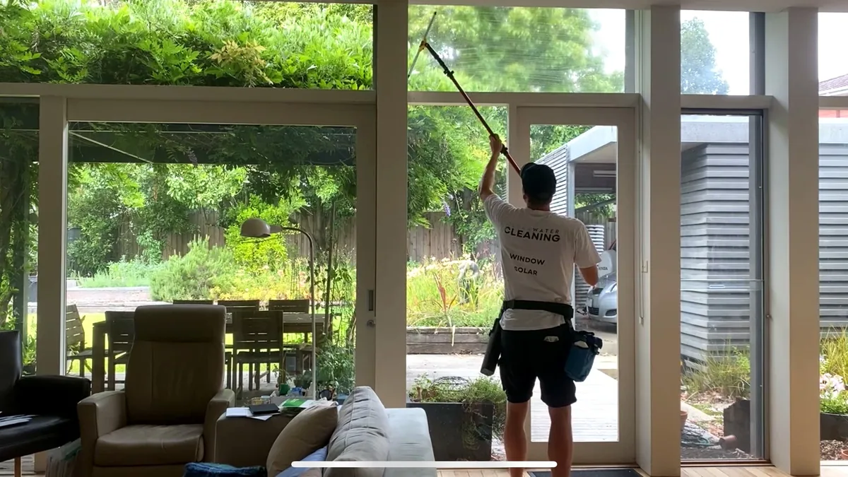 Cleaning high windows from ground level at a Melbourne home