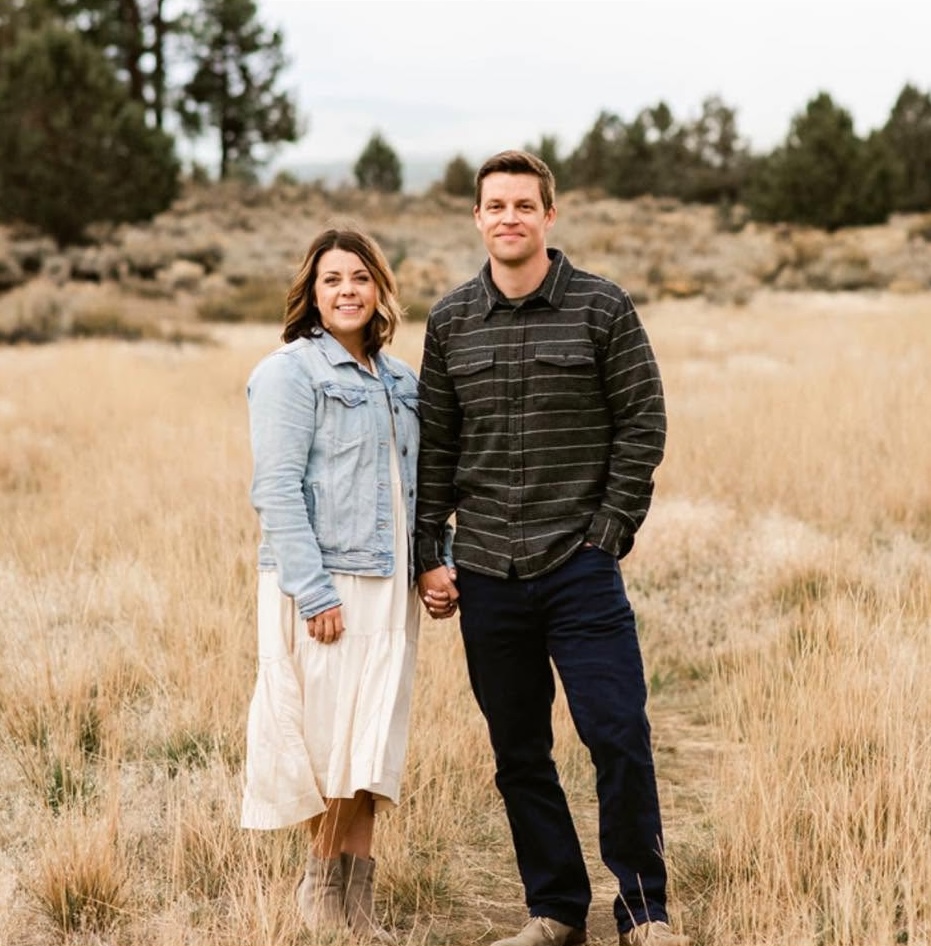 Andrew Ellis and Haley Ellis, owners of High Desert Realty, together in their office