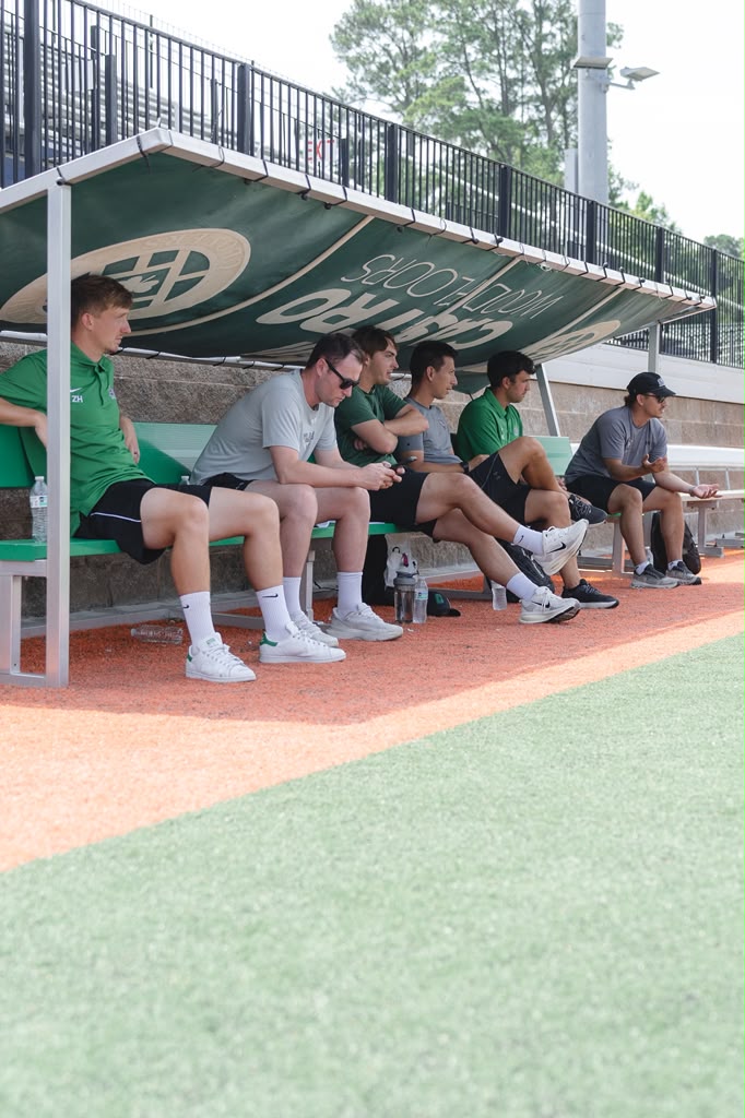 College recruiters observing live game play at the pitch