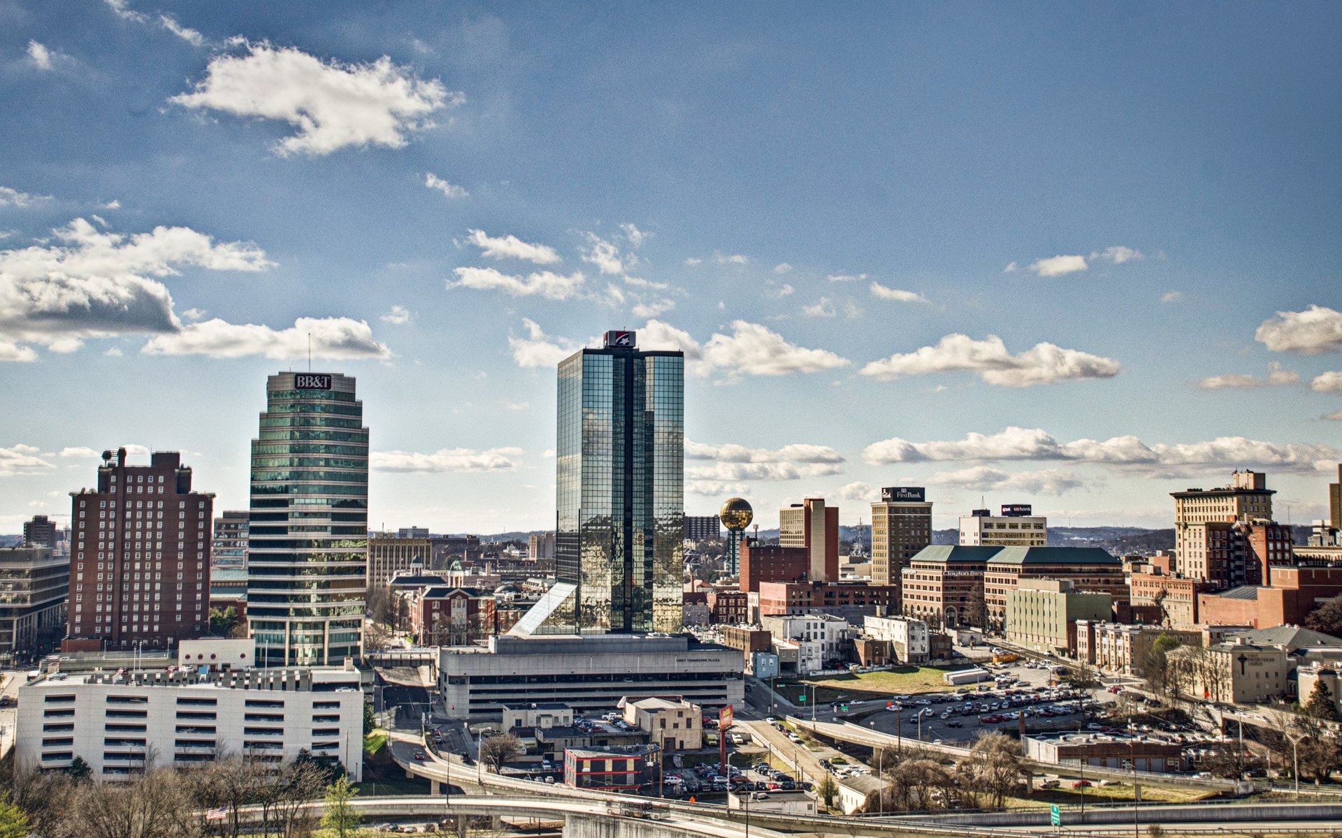 Knoxville skyline with Sunsphere and downtown buildings under blue sky