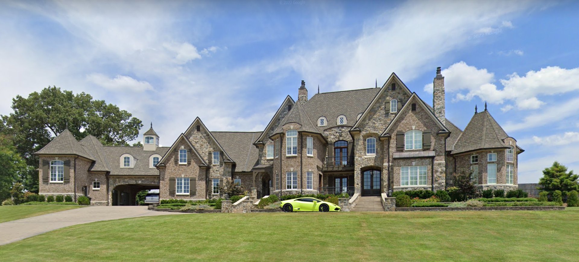 Grand custom stone estate with turrets and expansive lawn in East Tennessee