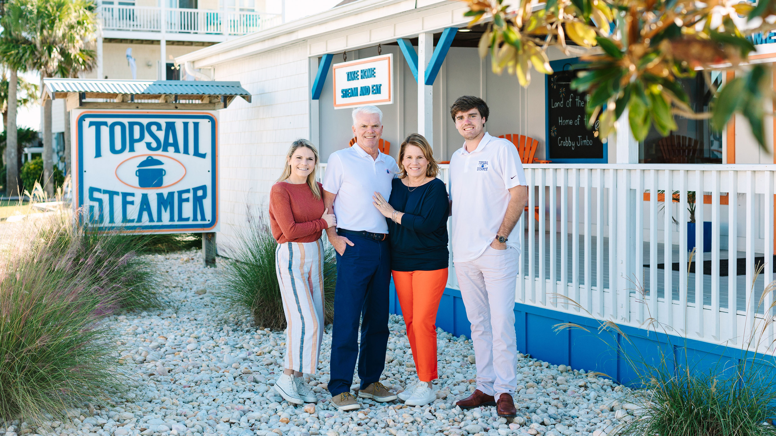 Topsail Steamer founders and team standing in front of their coastal restaurant location