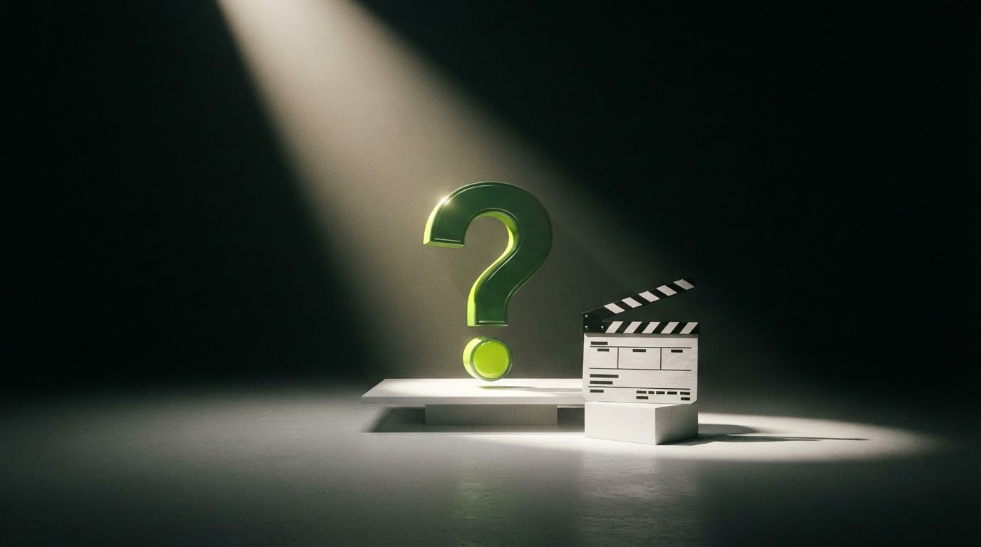 Paper film clapper and spotlight illuminating a question-mark sculpture