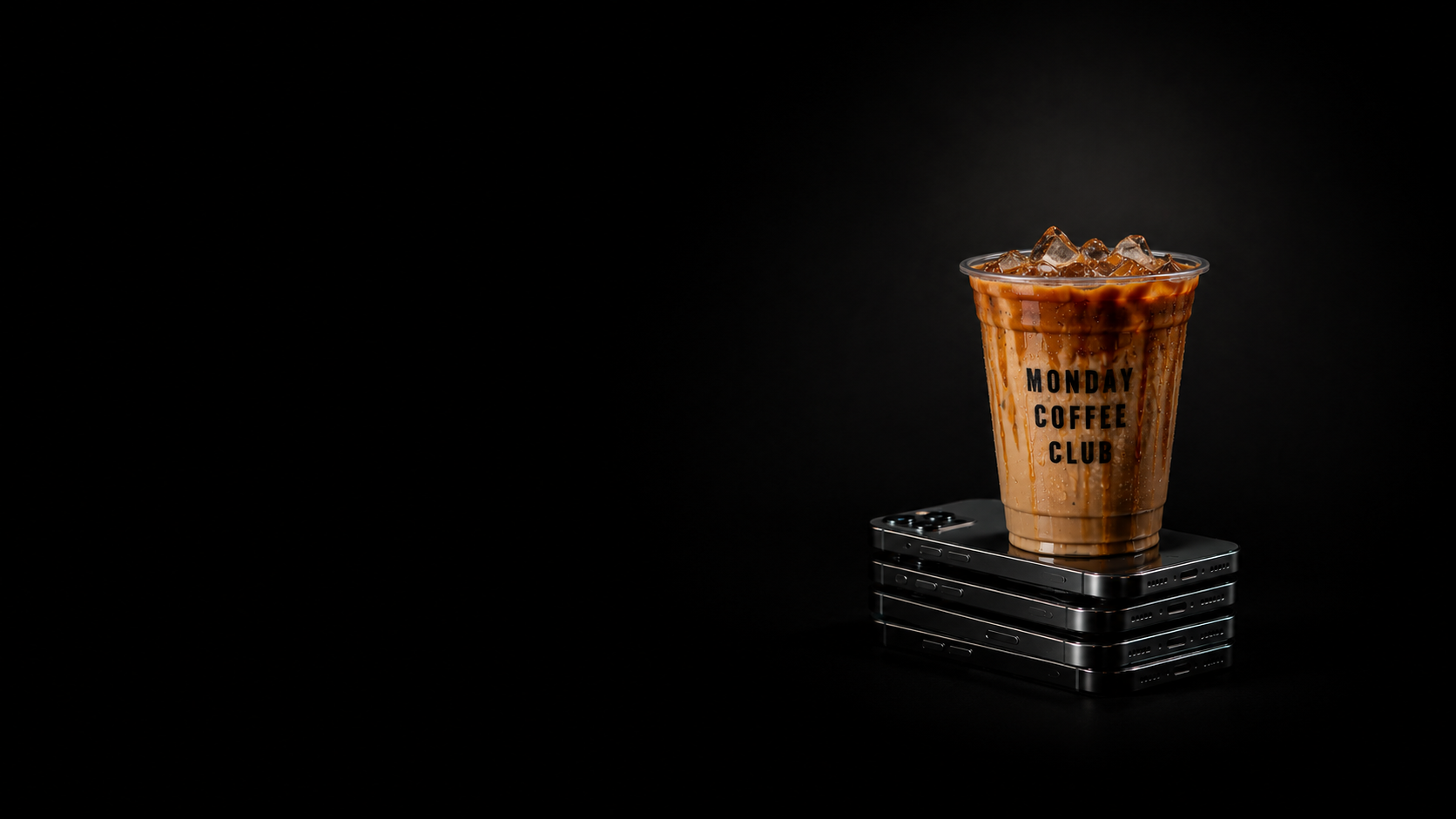 Monday Coffee Club iced drink on phone