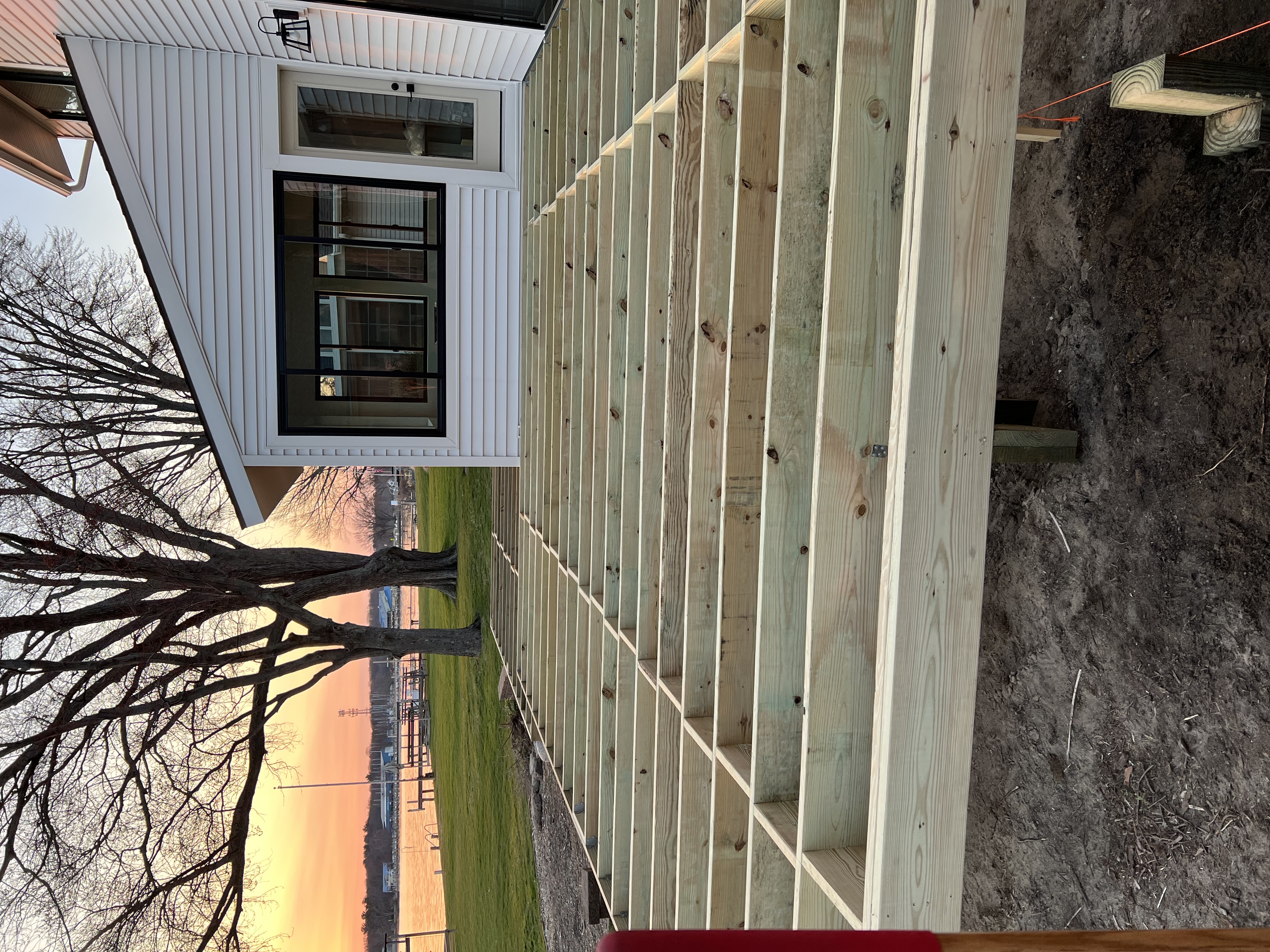 Before photo showing deck framing joists during waterfront deck construction