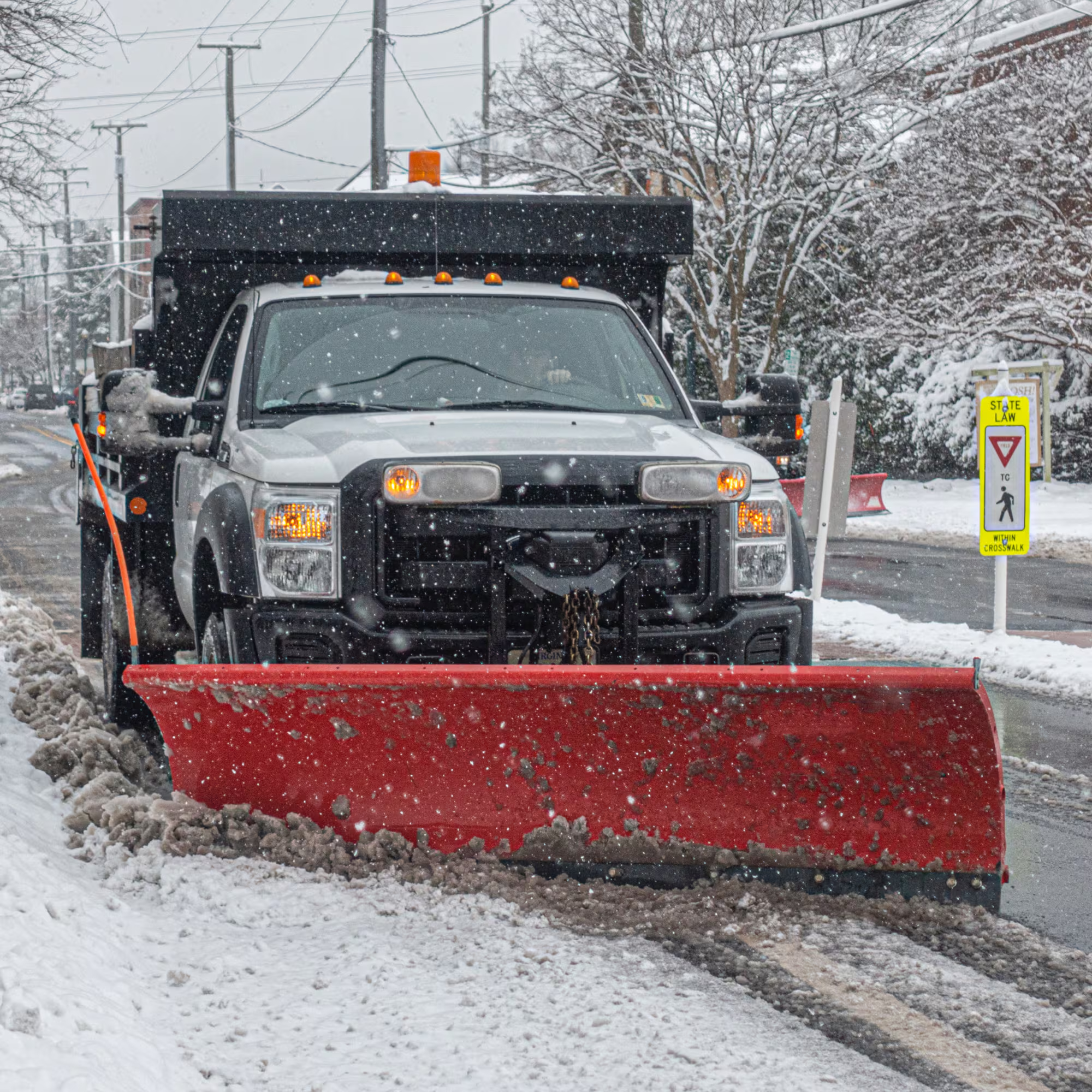 Grow Luck heavy-duty plow truck servicing snow removal route in Southeast Wisconsin