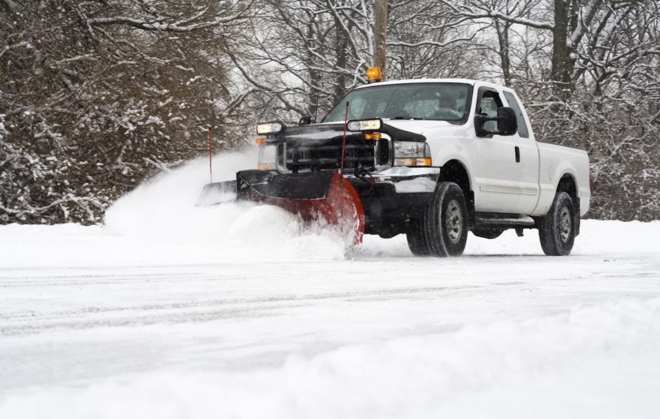 Grow Luck residential snow removal truck clearing driveway in Waukesha, Wisconsin