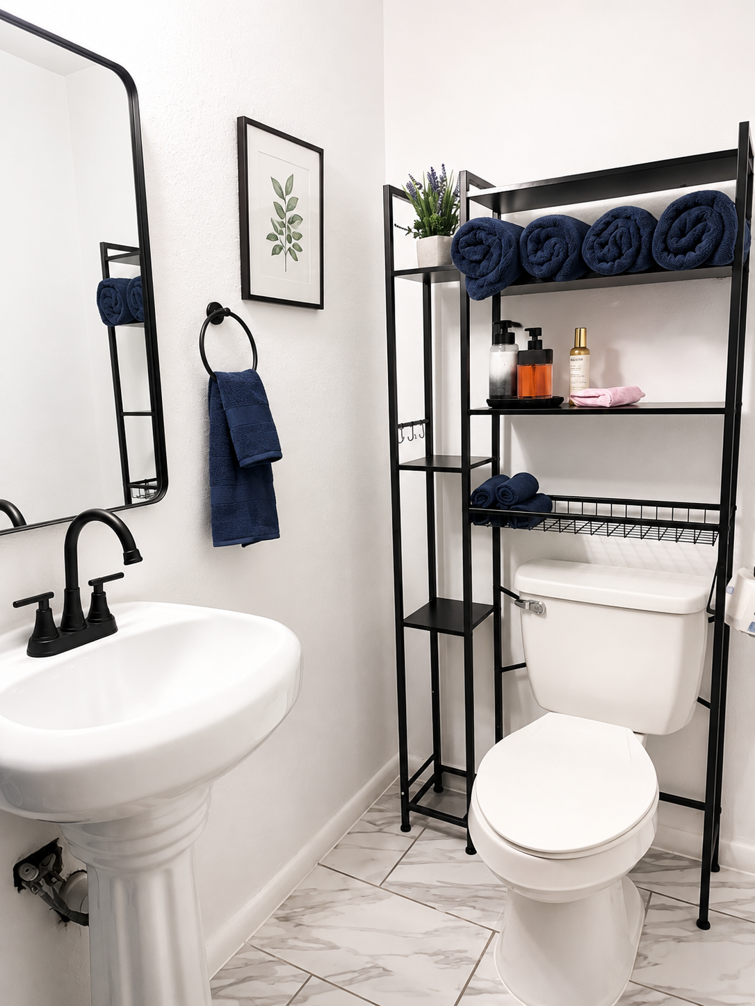 RCS Legacy Living bathroom with white walls, black fixtures, navy blue towels, marble-look tile flooring, black shelving unit, and clean organized space