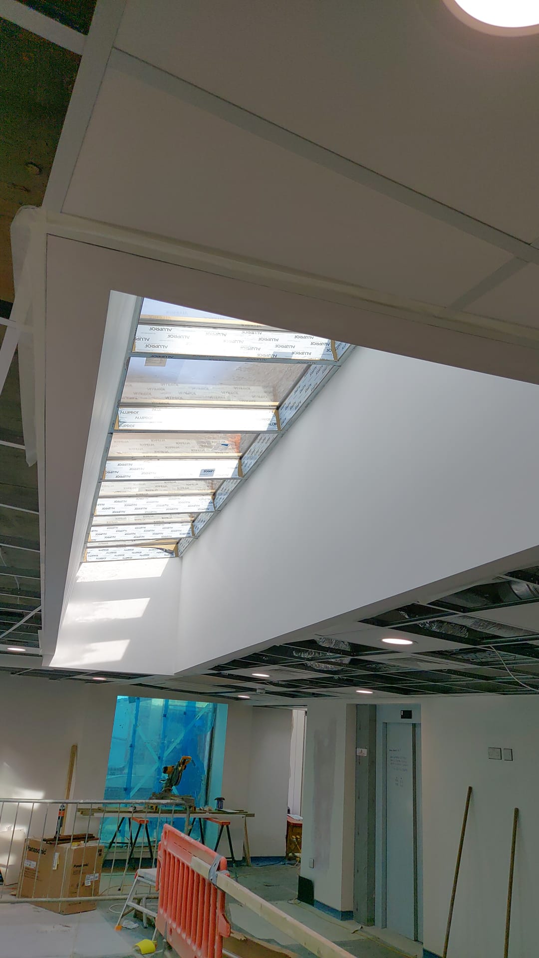 Horizon team member on-site applying plaster finish — active trade delivery
