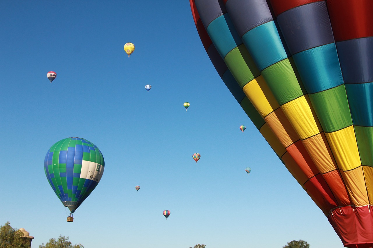 Colorful hot air balloons against a blue sky