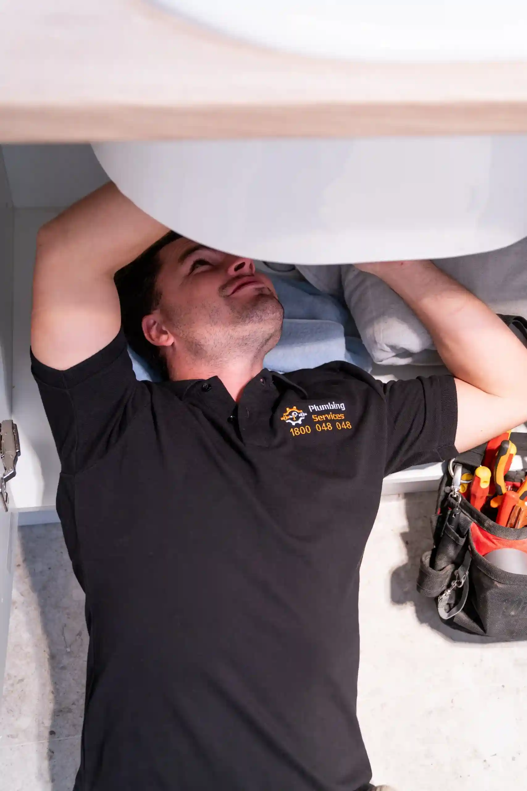 Plumber fixing drain