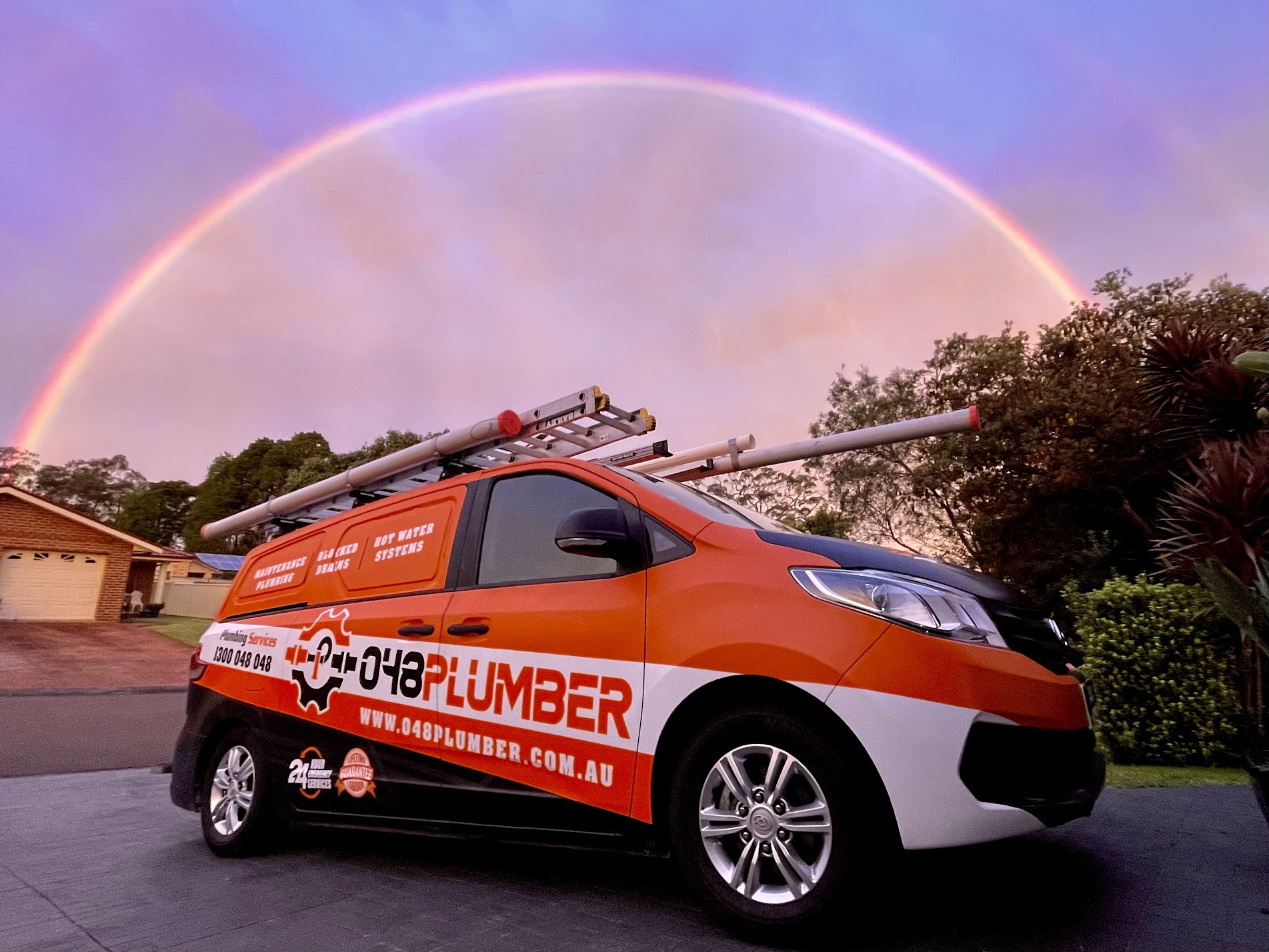 048 Plumber Central Coast branded van under a rainbow
