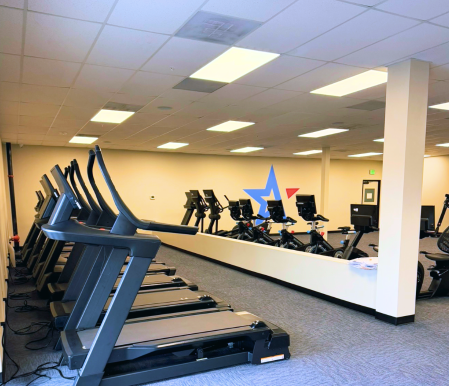 Fitness Premier Highlands Ranch cardio deck with treadmills, bikes, and gym floor